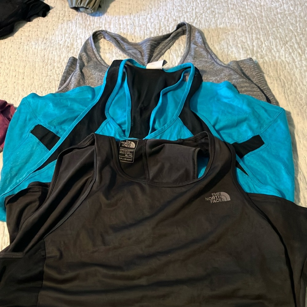 The North Face Black and Blue Tank Tops